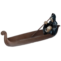 Resin incense burner in the shape of a boat with death itself as captain