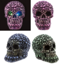 Led skull figure with iridescent colors and a multitude of mini skulls