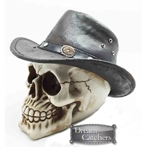Resin skull figure with a cowboy hat