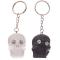Resin key ring in the shape of a skull with shiny eyes