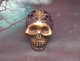 Gothic skull in brass